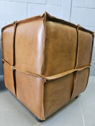 Savanna Leather Cube Ottoman in full-grain tan leather with reverse stitching — handcrafted by Maree Meubels, South Africa.