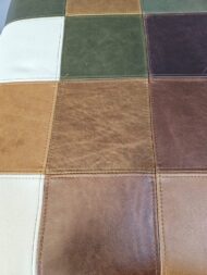 Patchwork Savanna Leather Ottoman handcrafted in full-grain leather with stitched patchwork design by Maree Meubels.