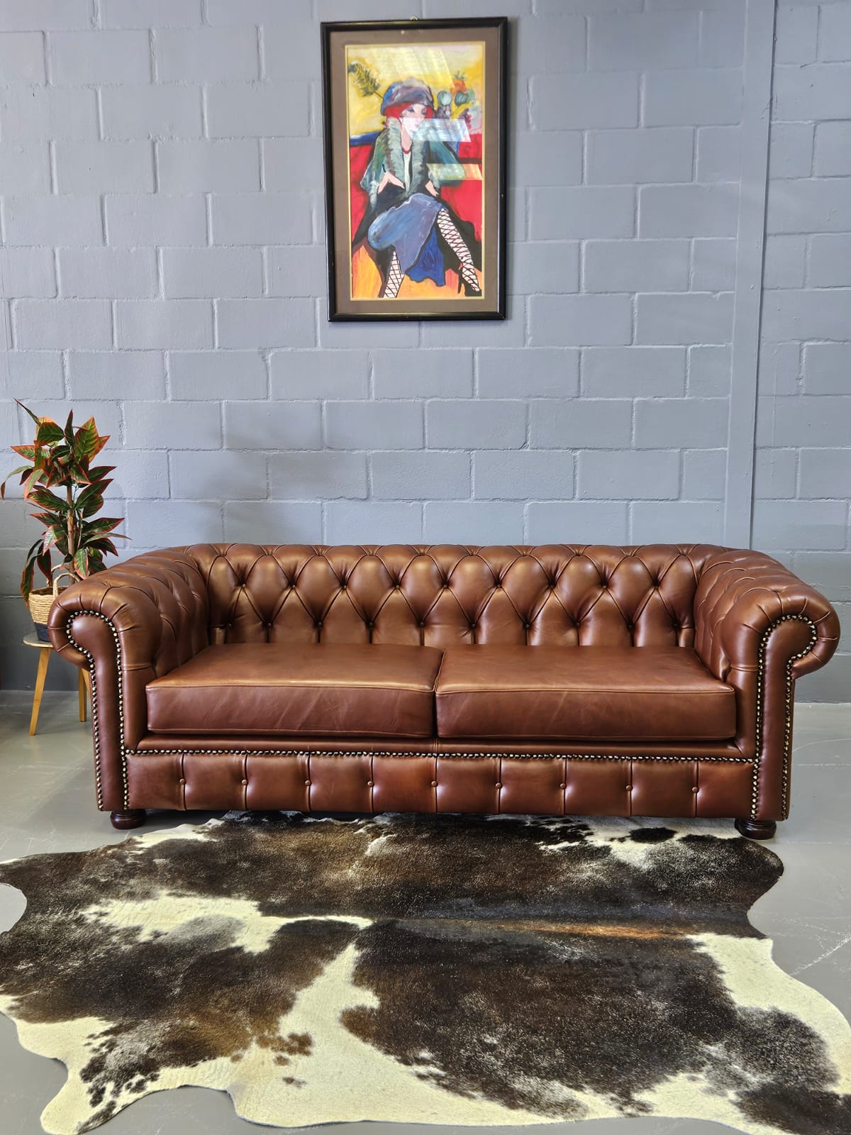 3 Seater Chesterfield in Naku Curry leather with bronze studs and polished wooden legs by Maree Meubels in Brackenfell Cape Town